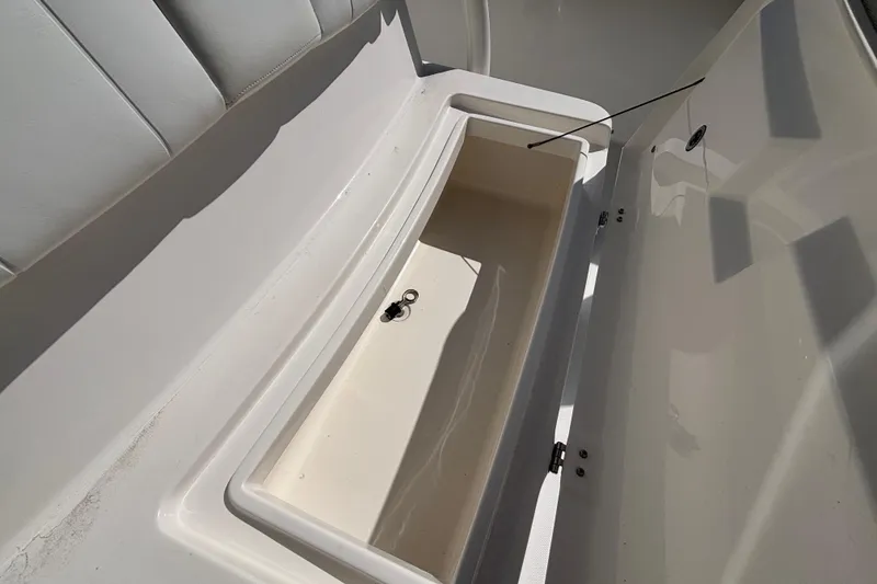 Slide: The Image of Open storage compartment on a 2017 Regulator 28 boat, showcasing interior space. - 13