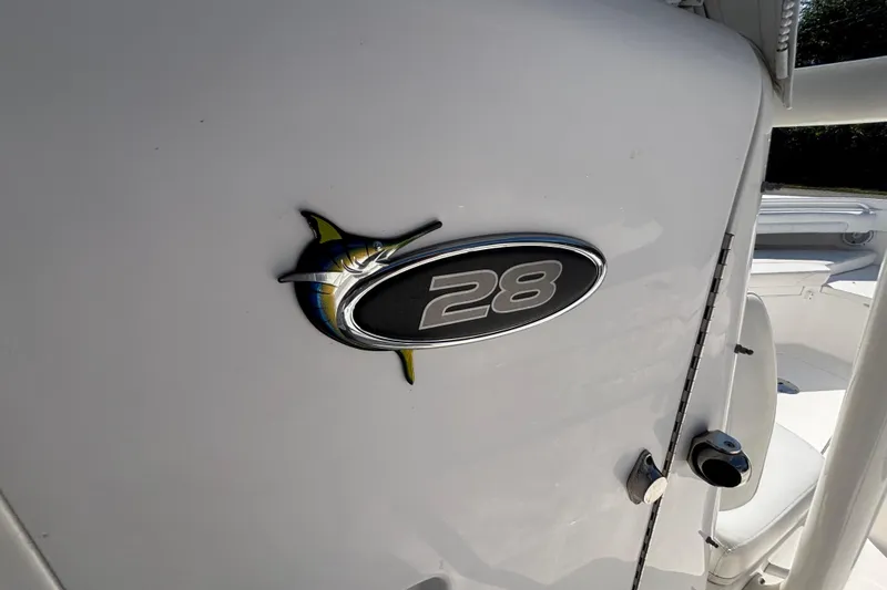 Slide: The Image of 2017 Regulator 28 boat emblem on white surface. - 19