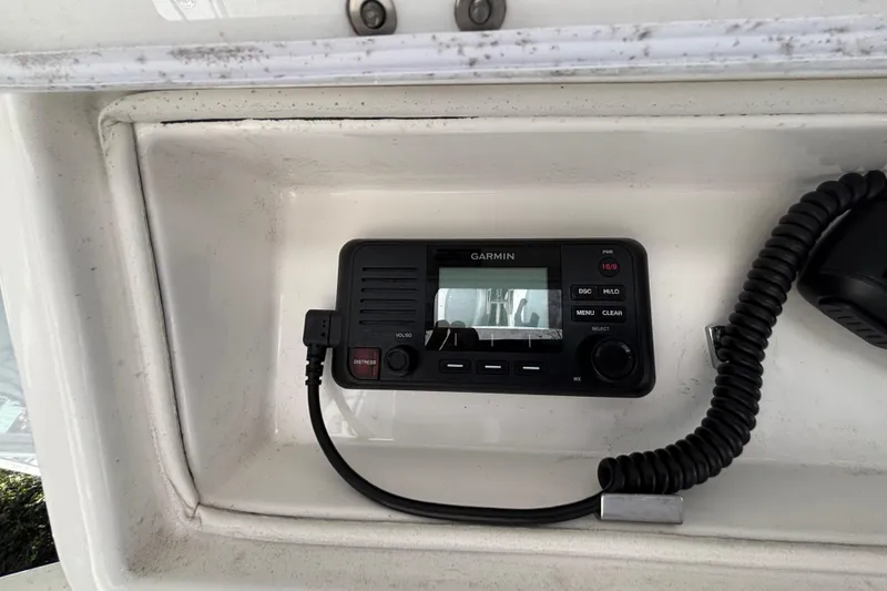 Slide: The Image of Garmin marine radio installed on a 2017 Regulator 28 boat dashboard. - 34