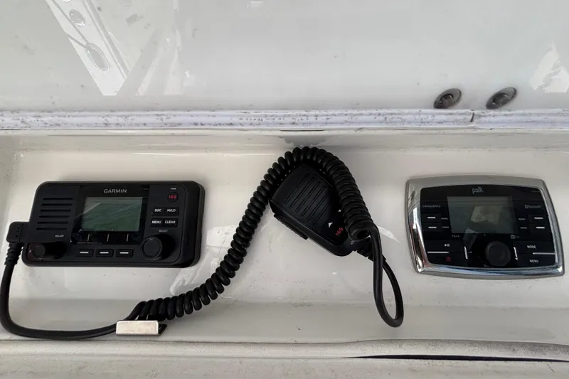 Slide: The Image of Garmin and Polk marine electronics on a 2017 Regulator 28 boat dashboard. - 35