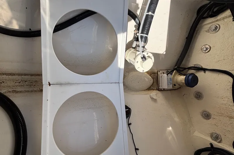 Slide: The Image of 2017 Regulator 28 boat interior showing wiring and components. - 53