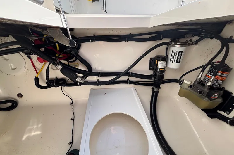 Slide: The Image of 2017 Regulator 28 boat wiring and components in the engine compartment. - 55