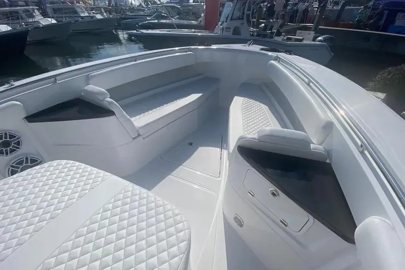 Slide: The Image of 2025 HCB 39 Speciale boat interior with luxurious seating and sleek design. - 10