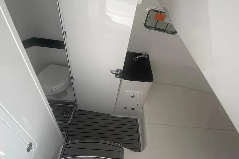 Slide: The Image of 2025 HCB 39 Speciale boat interior bathroom with toilet and sink. - 11