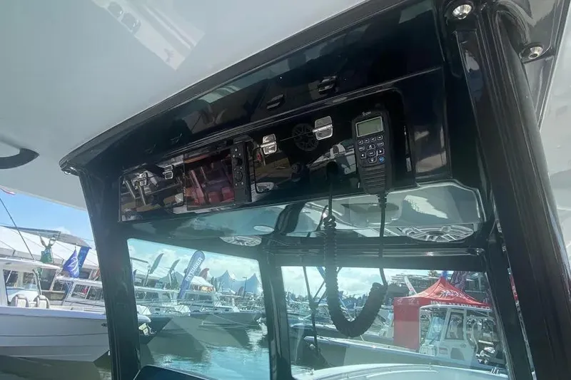 Slide: The Image of 2025 HCB 39 Speciale boat dashboard with radio and control panel. - 12