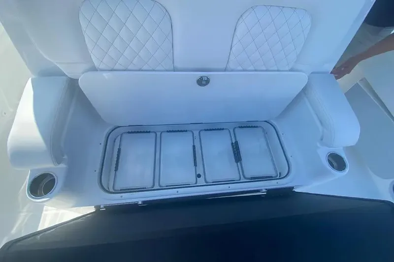 Slide: The Image of 2025 HCB 39 Speciale boat seating with storage compartments and cup holders. - 14