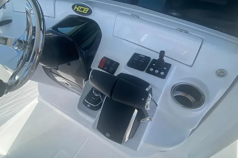 Slide: The Image of 2025 HCB 39 Speciale boat dashboard with steering wheel and control panel. - 16