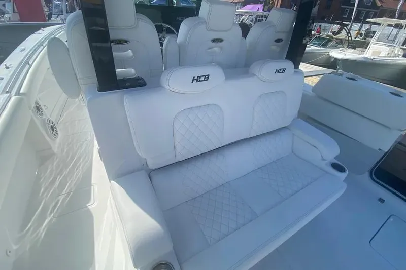 Slide: The Image of Luxurious seating on 2025 HCB 39 Speciale boat with quilted white upholstery. - 7