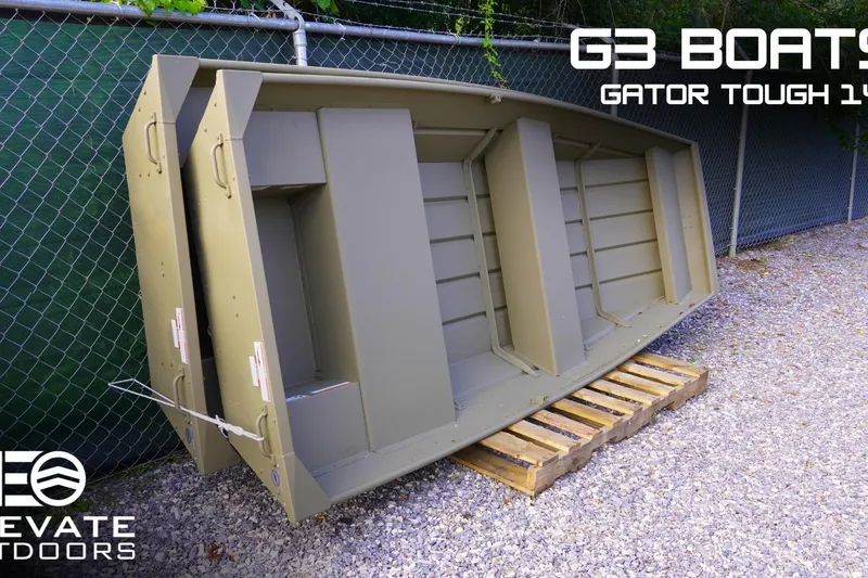 The Image of 2026 G3 Gator Tough 1436 boat displayed outdoors on a wooden pallet. - 1