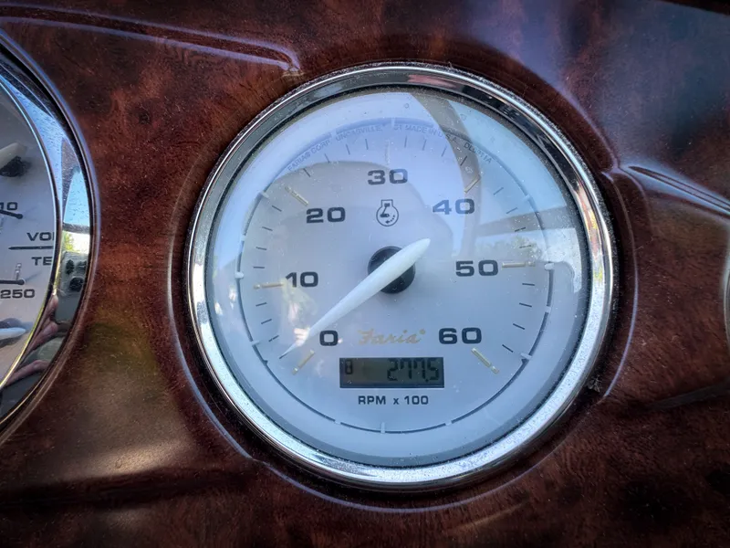 Slide: The Image of Close-up of a 2016 Rinker 290 Express tachometer displaying 2775 RPM. - 14