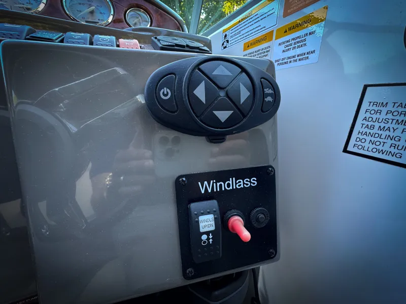 Slide: The Image of Control panel of a 2016 Rinker 290 Express boat with windlass switch. - 15