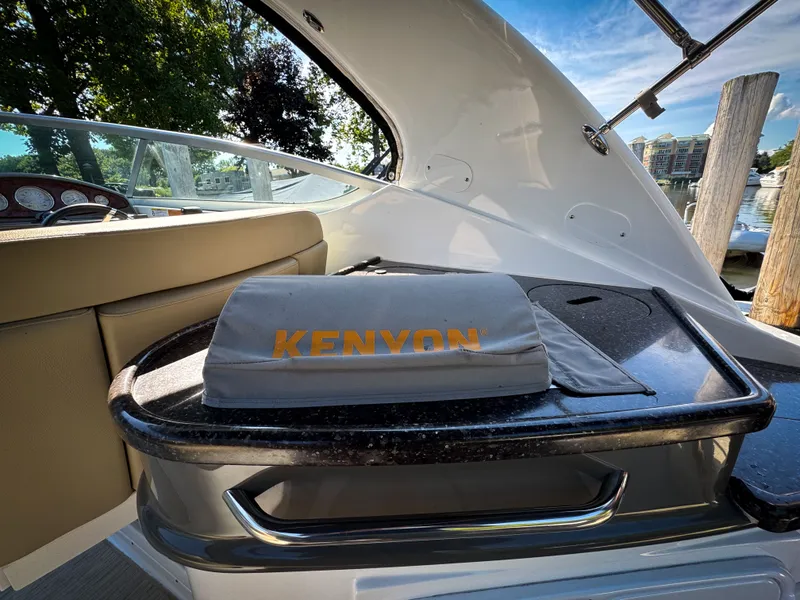 Slide: The Image of Interior of 2016 Rinker 290 Express boat with Kenyon grill cover. - 27