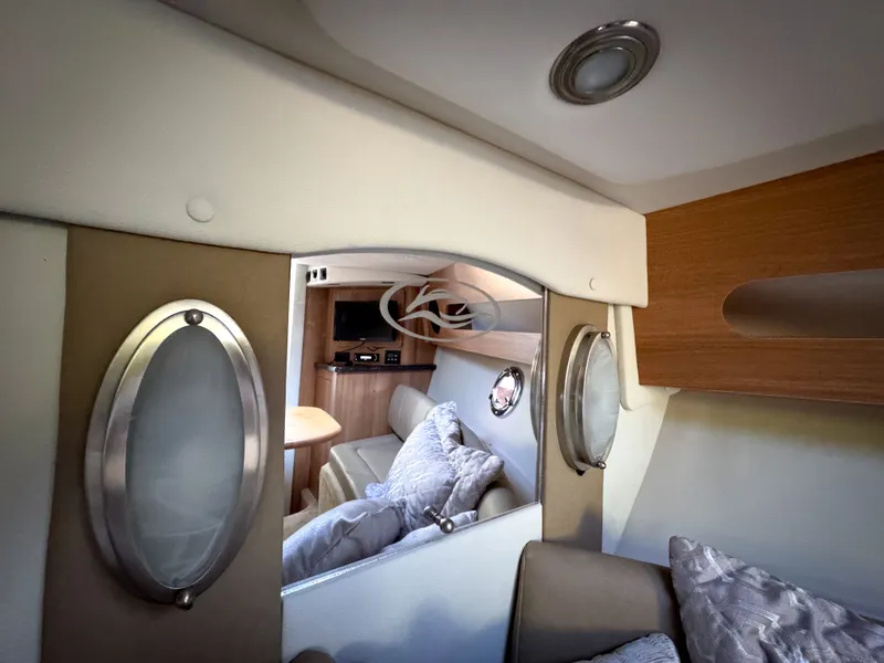 Slide: The Image of Interior of 2016 Rinker 290 Express boat with cozy seating and modern design. - 43