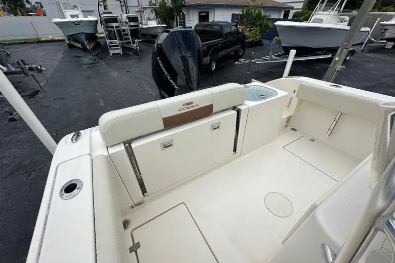 Slide: The Image of 2022 Cobia 237 Center Console boat interior with seating and storage compartments. - 17