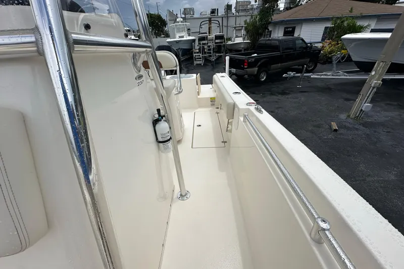 Slide: The Image of 2022 Cobia 237 Center Console boat interior with safety equipment and sleek design. - 24