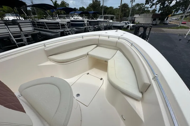 Slide: The Image of 2022 Cobia 237 Center Console boat with spacious seating area and sleek design. - 26