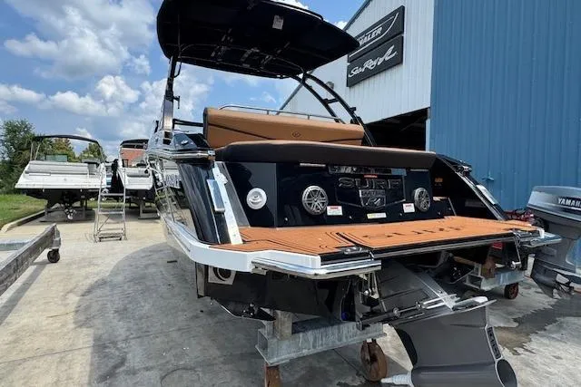 Slide: The Image of 2026 Cobalt R4 Surf boat on trailer, showcasing sleek design and modern features. - 11