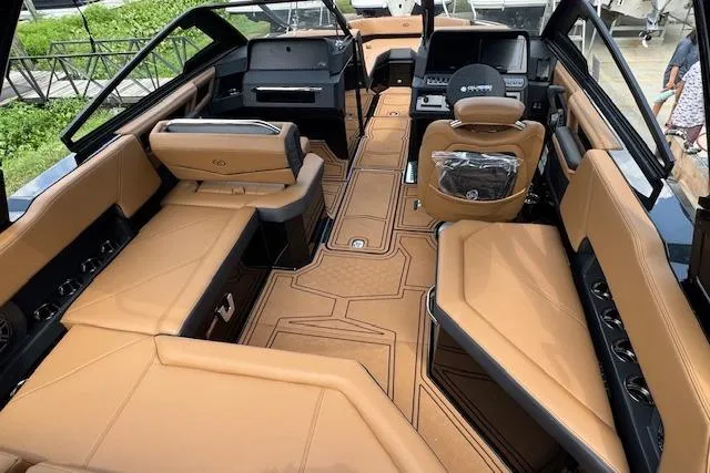 Slide: The Image of Luxurious interior of 2026 Cobalt R4 Surf boat with tan leather seating and modern dashboard. - 14