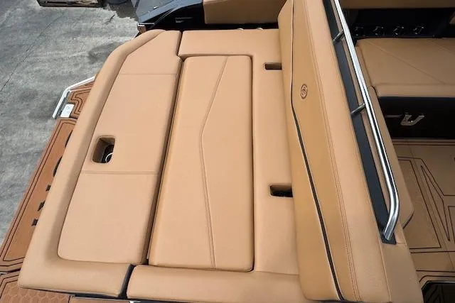 Slide: The Image of 2026 Cobalt R4 Surf boat with tan leather seating and sleek design. - 15