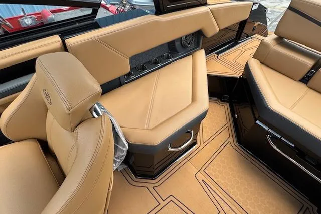 Slide: The Image of Luxurious interior of 2026 Cobalt R4 Surf boat with tan leather seating. - 17