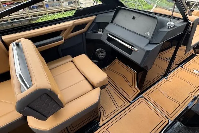 Slide: The Image of 2026 Cobalt R4 Surf boat interior with tan leather seats and modern dashboard design. - 20