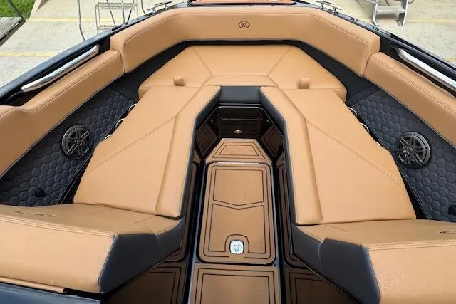 Slide: The Image of 2026 Cobalt R4 Surf boat interior with tan leather seating and black accents. - 22