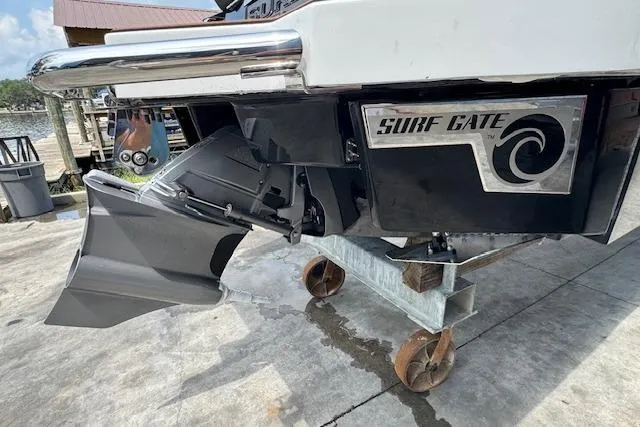 Slide: The Image of 2026 Cobalt R4 Surf boat with Surf Gate technology on a trailer. - 8