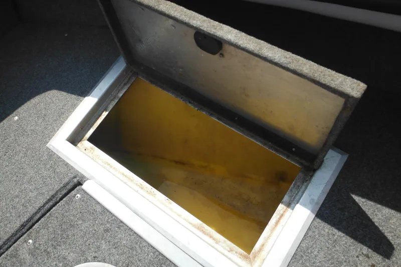 Slide: The Image of Open storage compartment in 1993 Sea Nymph SS175 Fish-n-ski boat. - 10