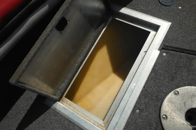 Slide: The Image of Open storage compartment on 1993 Sea Nymph SS175 Fish-n-ski boat. - 12