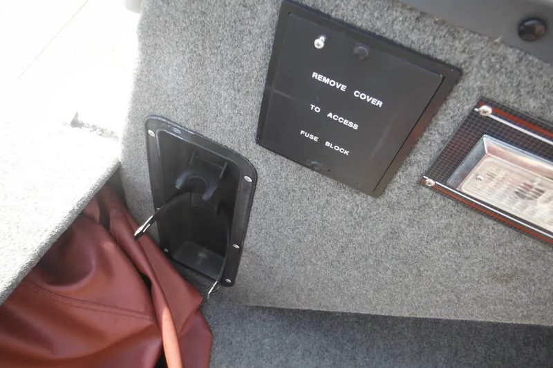 Slide: The Image of 1993 Sea Nymph SS175 Fish-n-ski interior showing fuse block access panel. - 16