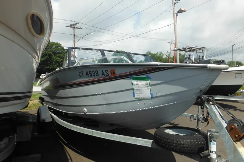 Slide: The Image of 1993 Sea Nymph SS175 Fish-n-ski boat on trailer, parked outdoors. - 2
