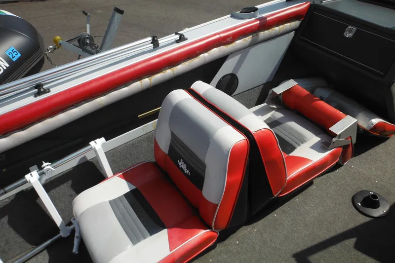 Slide: The Image of 1993 Sea Nymph SS175 Fish-n-ski boat interior with red and gray seating. - 24