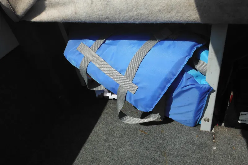 Slide: The Image of Blue life jackets stored under seat in 1993 Sea Nymph SS175 Fish-n-ski boat. - 27