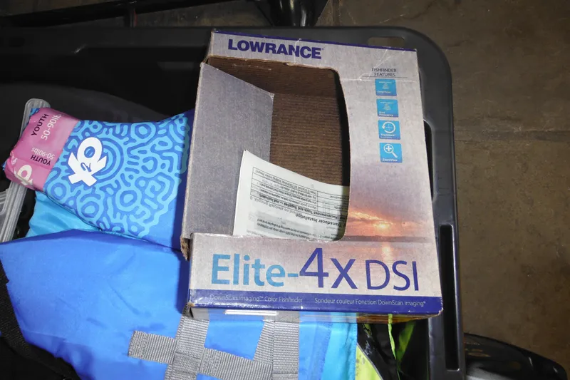 Slide: The Image of Box of Lowrance Elite-4X DSI fishfinder with colorful life jacket, Sea Nymph SS175 Fish-n-ski. - 30