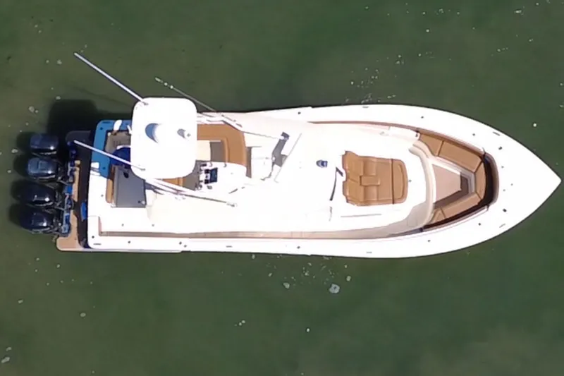 Slide: The Image of Aerial view of 2016 Scout 420 LXF boat with four engines. - 10