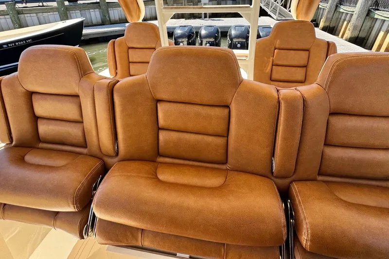 Slide: The Image of Luxurious brown leather seating on a 2016 Scout 420 LXF boat. - 31