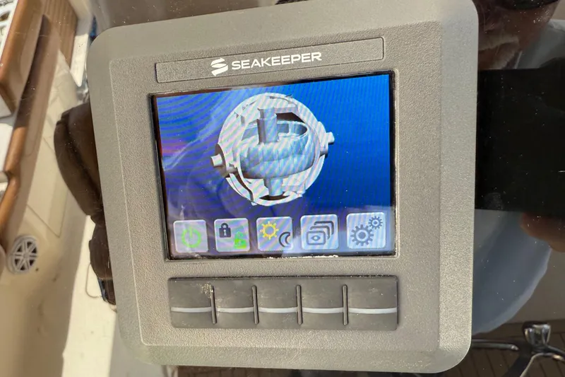 Slide: The Image of Seakeeper control panel on 2016 Scout 420 LXF boat, displaying interface and icons. - 37