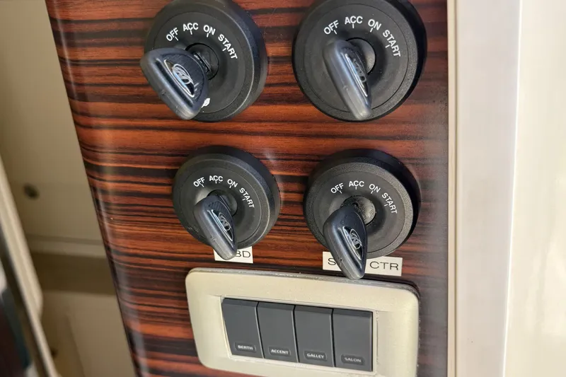 Slide: The Image of Control panel with ignition switches on a 2016 Scout 420 LXF boat. - 38