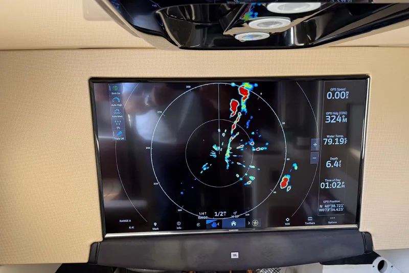 Slide: The Image of Radar display on 2016 Scout 420 LXF boat showing navigation and environmental data. - 57