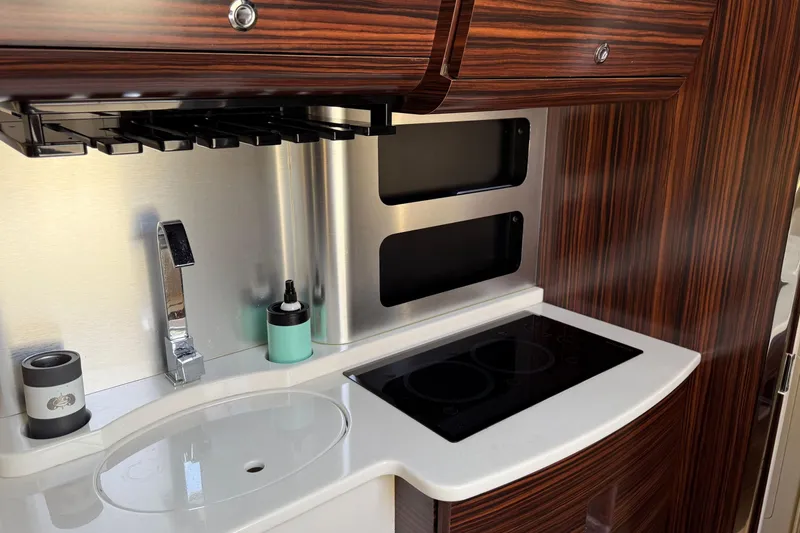 Slide: The Image of Luxurious kitchen area in 2016 Scout 420 LXF boat with modern amenities. - 58