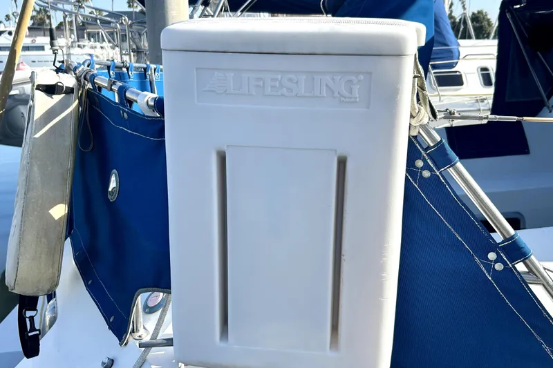 Slide: The Image of Lifesling on 1991 Catalina 42 MkII sailboat, docked with blue canvas cover. - 11