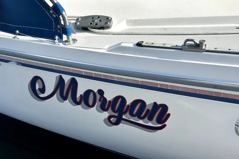 Slide: The Image of Side view of 1991 Catalina 42 MkII sailboat with "Morgan" name in bold script. - 13