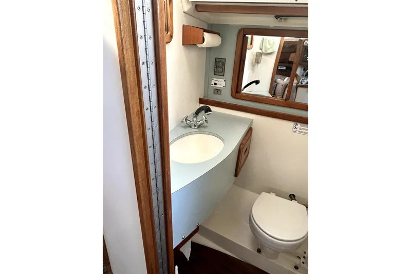 Slide: The Image of Bathroom interior of 1991 Catalina 42 MkII sailboat with sink and toilet. - 6