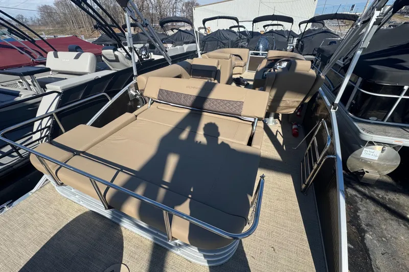 Slide: The Image of 2018 Bennington 23 SSBXP pontoon boat with beige seating and stainless steel railings. - 14