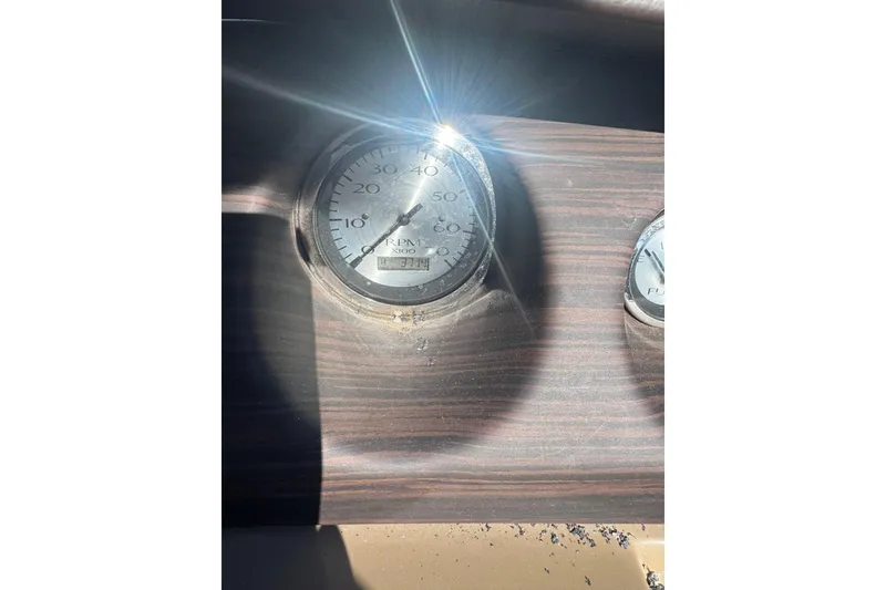 Slide: The Image of Dashboard of 2018 Bennington 23 SSBXP with RPM gauge in sunlight. - 17