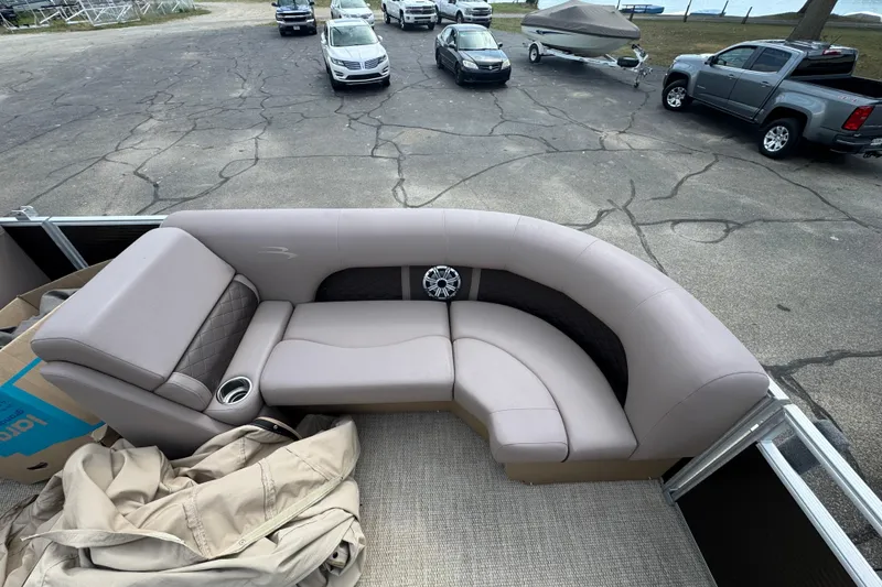 Slide: The Image of 2018 Bennington 23 SSBXP pontoon boat with plush seating and cup holders. - 3