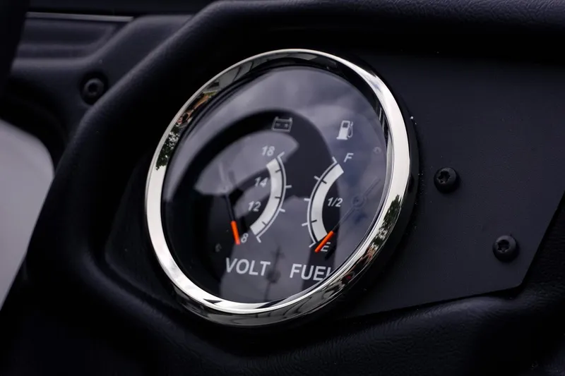 Slide: The Image of Close-up of 2026 Skeeter ZXR20 SE dashboard gauges showing voltage and fuel levels. - 11
