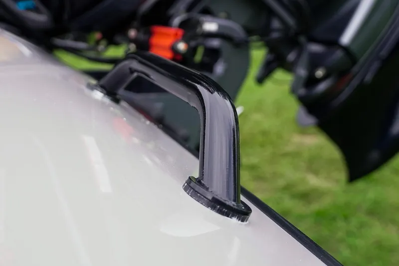 Slide: The Image of Close-up of a 2026 Skeeter ZXR20 SE boat handle on a sleek surface. - 13