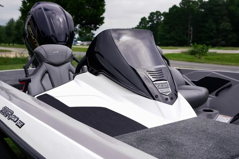 Slide: The Image of 2026 Skeeter ZXR20 SE boat with sleek design and modern features, parked outdoors. - 18
