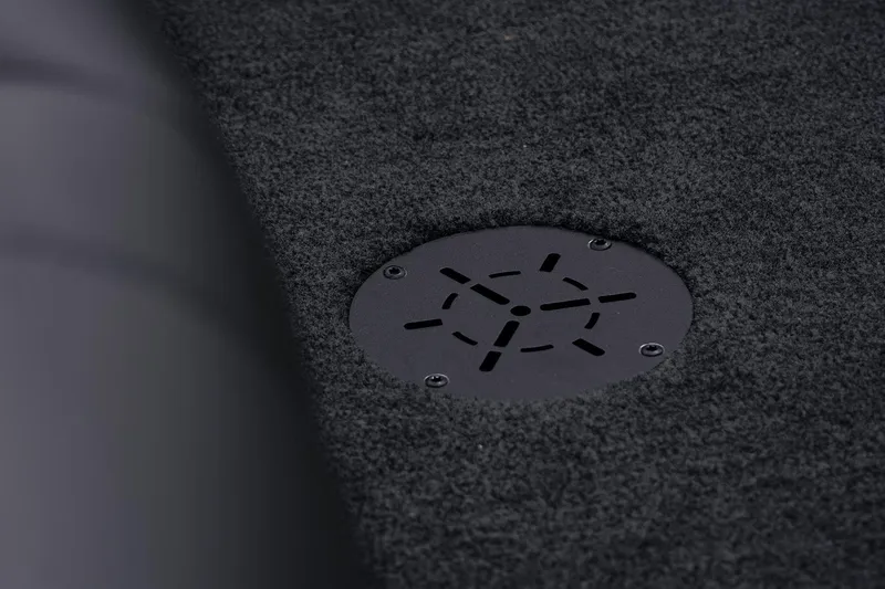 Slide: The Image of 2026 Skeeter ZXR20 SE boat carpet with circular drainage vent. - 19